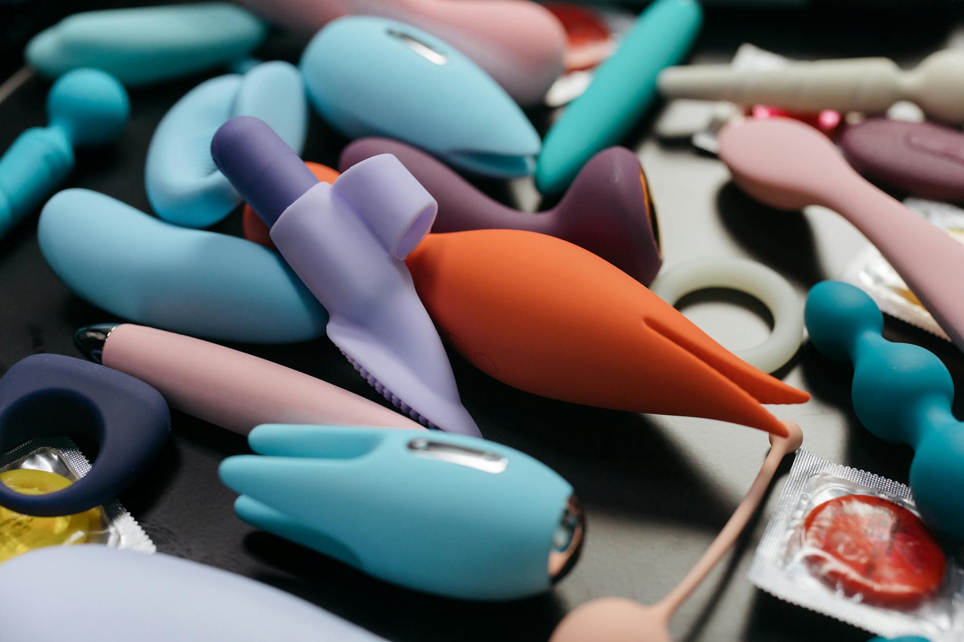 A couple standing close together, exploring intimacy with a vibrator in their relationship